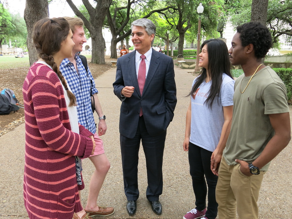 Greg Fenves, the president of the University of Texas, center, talks with students. (University of Texas)
