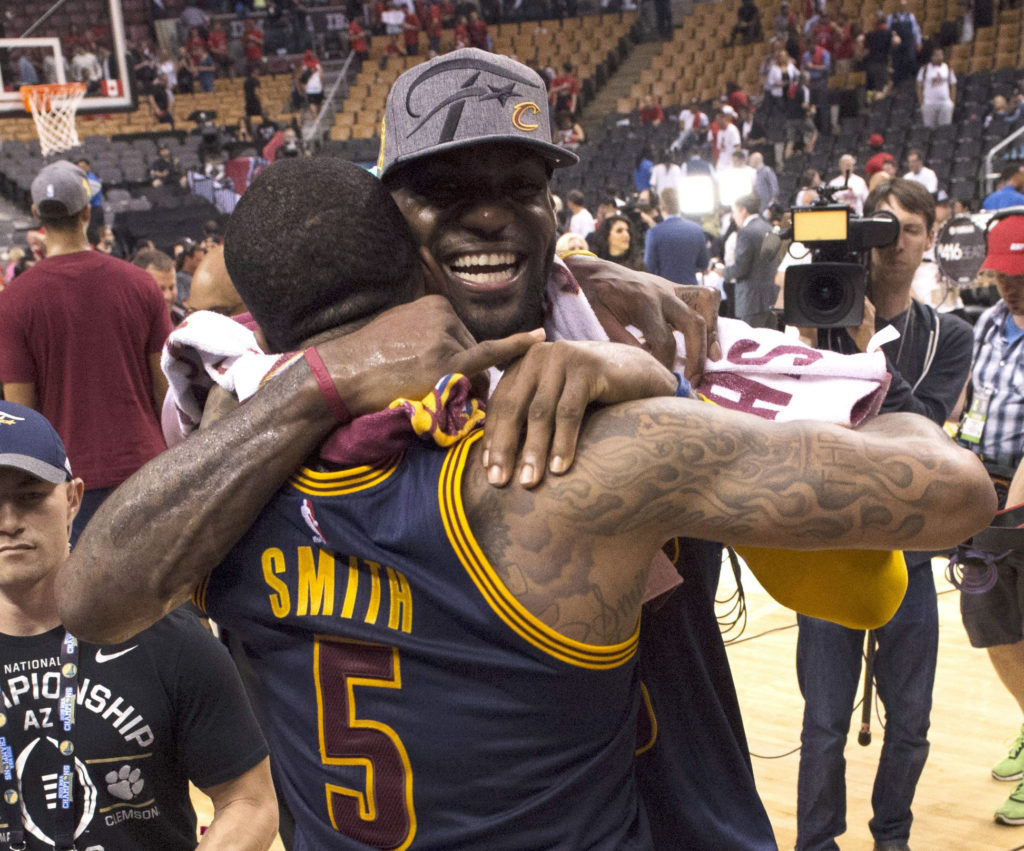 <p>Cleveland Cavaliers forward LeBron James celebrates the team's win over the Toronto Raptors with J.R. Smith after Game 6 of the NBA basketball Eastern Conference finals.</p>