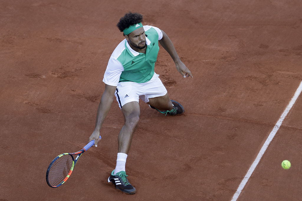 <p>Jo-Wilfried Tsonga makes a shot against Renzo Olivo at the French Open in Paris, France. Tuesday. (AP Photo/Petr David Josek)</p>
