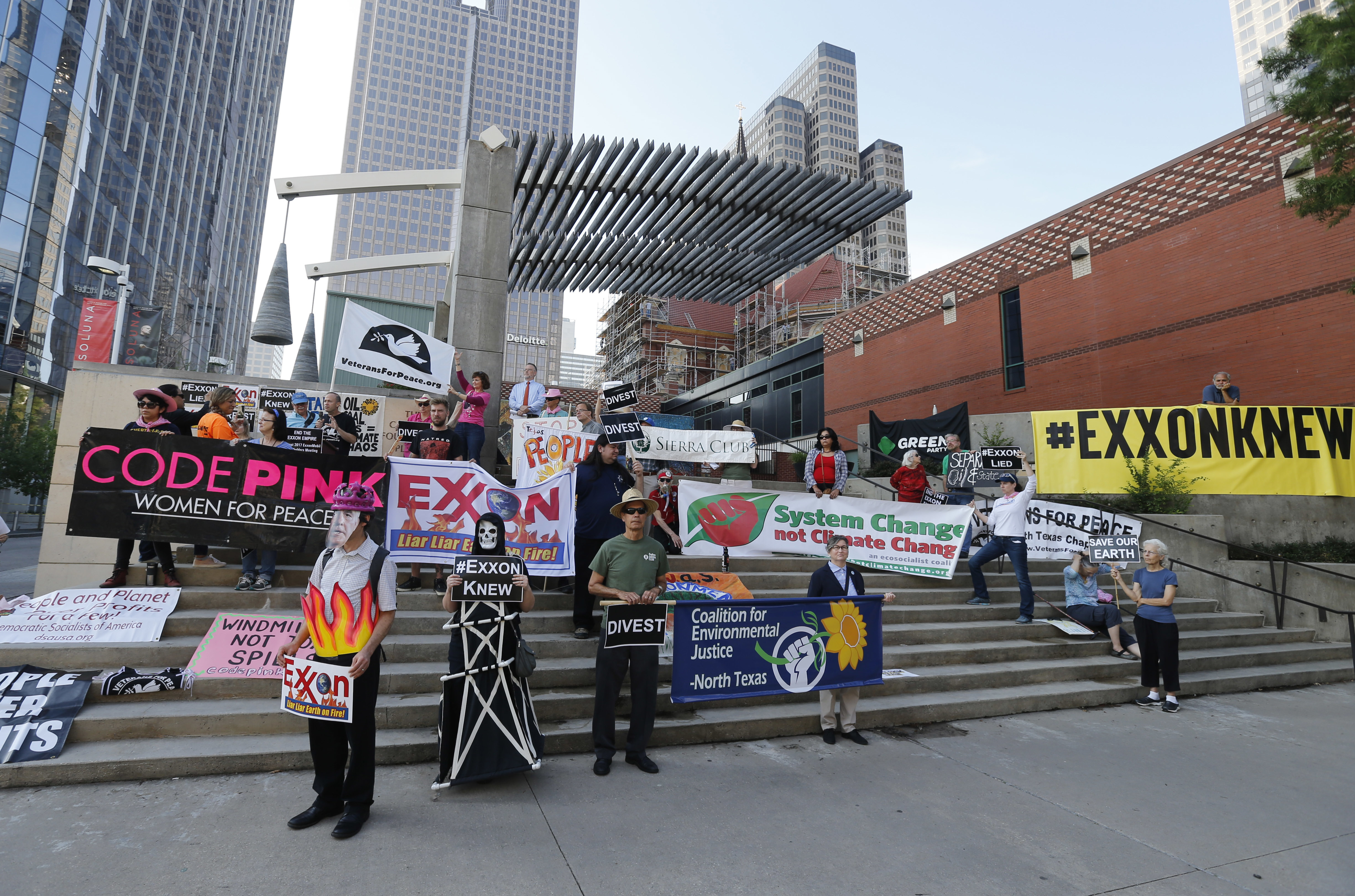 <p>Protesters gather outside the Exxon shareholders meeting across the street from Morton H. Meyerson Symphony Center in Dallas on Wednesday, May 31, 2017. The company holds its annual meeting as profit is down and the stock price has been sagging.</p>
