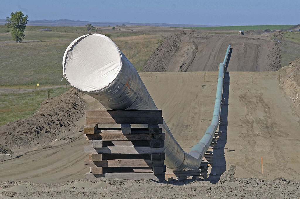 <p>This Sept. 29, 2016, file photo, shows a section of the Dakota Access pipeline under construction near St. Anthony in Morton County, North Dakota. The Dakota Access pipeline system leaked about 100 gallons of oil in western North Dakota in two separate incidents in March as crews worked to get the four-state line ready for operation. They’re the second and third known leaks on the disputed $3.8 billion pipeline. (Tom Stromme/The Bismarck Tribune via AP, File)</p>