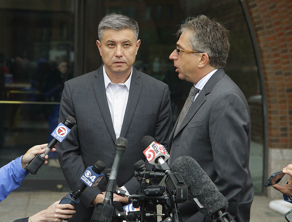 Murat Kadyrbayev, left, the father of Dias Kadyrbayev, 21, stands outside Federal court with his interpreter, Alexander Tetradze, Tuesday, June 2, 2015, answering reporters questions about the sentencing of his son, a college friend of Boston Marathon bomber Dzhokhar Tsarnaev, sentenced Tuesday to six years in prison after he apologized to the victims and their families for not calling police when he recognized photos of Tsarnaev as a suspect Tuesday, June 2, 2015, in Boston. Kadyrbayev, 21, pleaded guilty last year to obstruction of justice and conspiracy charges for removing items from Tsarnaevs dorm room after recognizing his friend in photos released by the FBI. (AP Photo/Stephan Savoia)