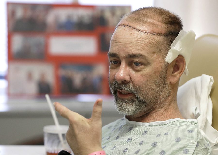 In this photo taken on Wednesday, June 3, 2015, James Boysen is interviewed in his hospital bed at Houston Methodist Hospital in Houston. Texas doctors say he received the worlds first skull and scalp transplant from a human donor to help heal a large head wound from cancer treatment. (AP Photo/Pat Sullivan)