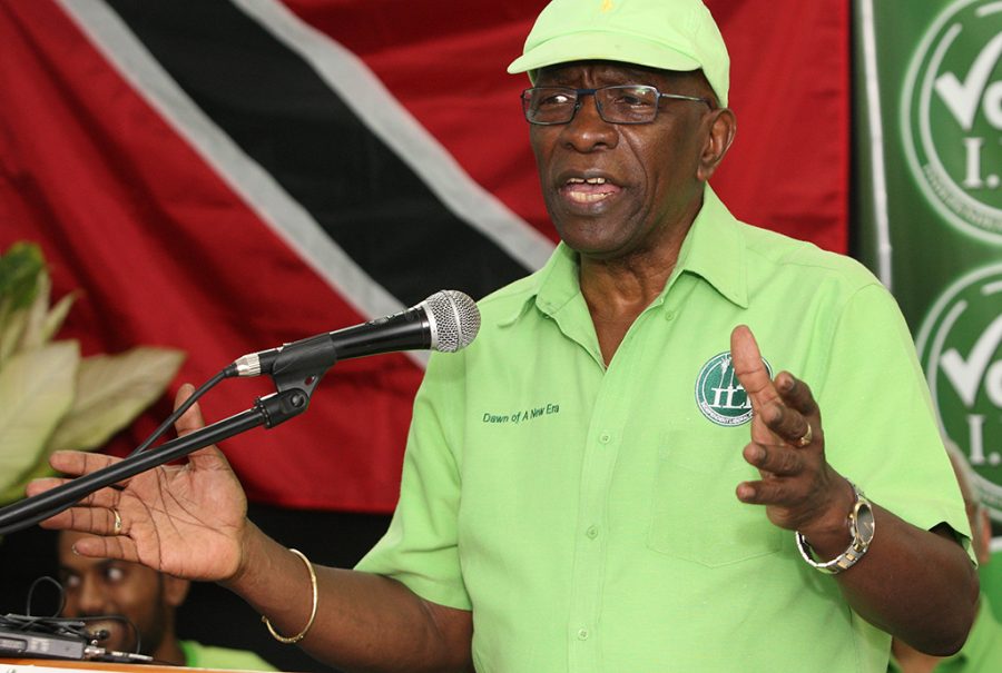 Former FIFA vice president Jack Warner speaks Wednesday at a political rally in Marabella, Trinidad and Tobago. One moment, Jack Warner is on TV telling his countrymen in Trinidad that he fears for his life. An hour later, hes standing on a packed narrow street at a political rally telling supporters that he fears nothing. Indicted by the United States on charges of racketeering, wire fraud and money-laundering, Warner is officially an internationally wanted man, listed as one of Interpol’s most wanted persons. (AP Photo/Anthony Harris)