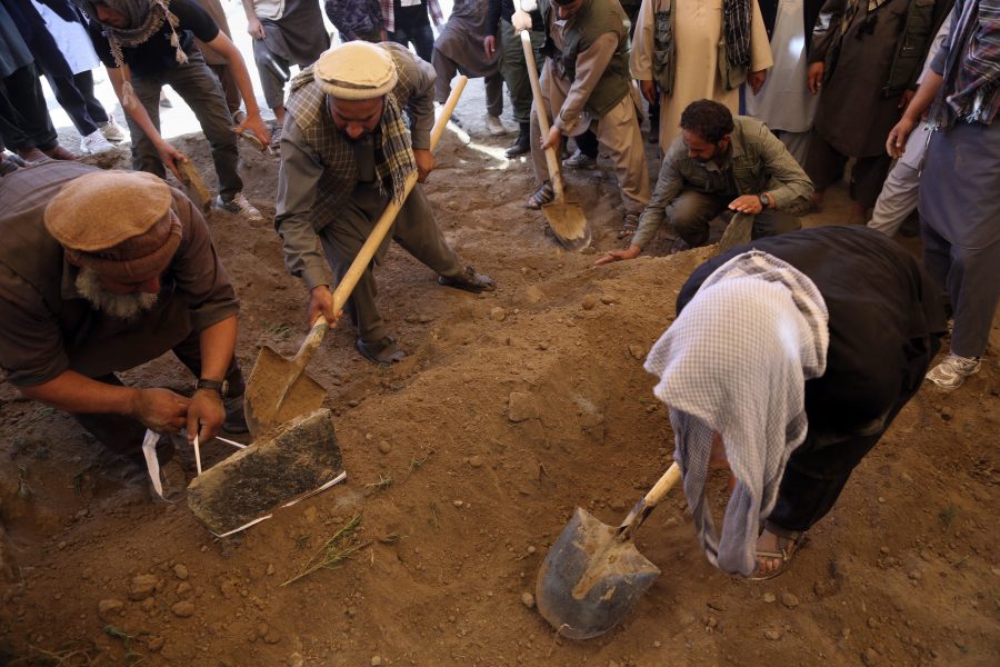 Afghans bury a victim of Wednesday's massive bombing, in the capital, Kabul, Afghanistan, Thursday, June 1, 2017. Afghans mourned the loss of family members, friends and colleagues a day after the truck bomb left at least 90 people dead and over 400 others wounded. (AP Photo/Rahmat Gul)
