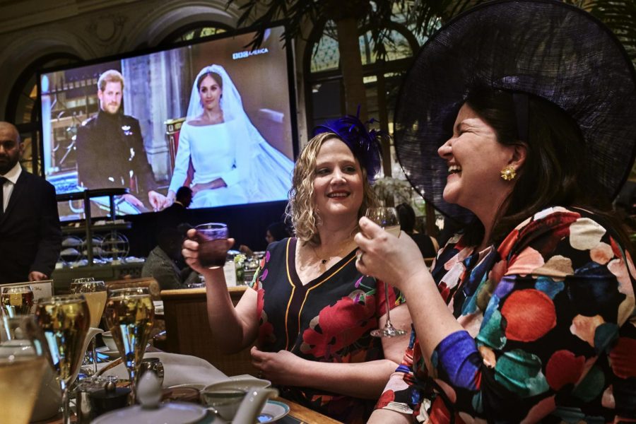 Two women toast during a viewing party