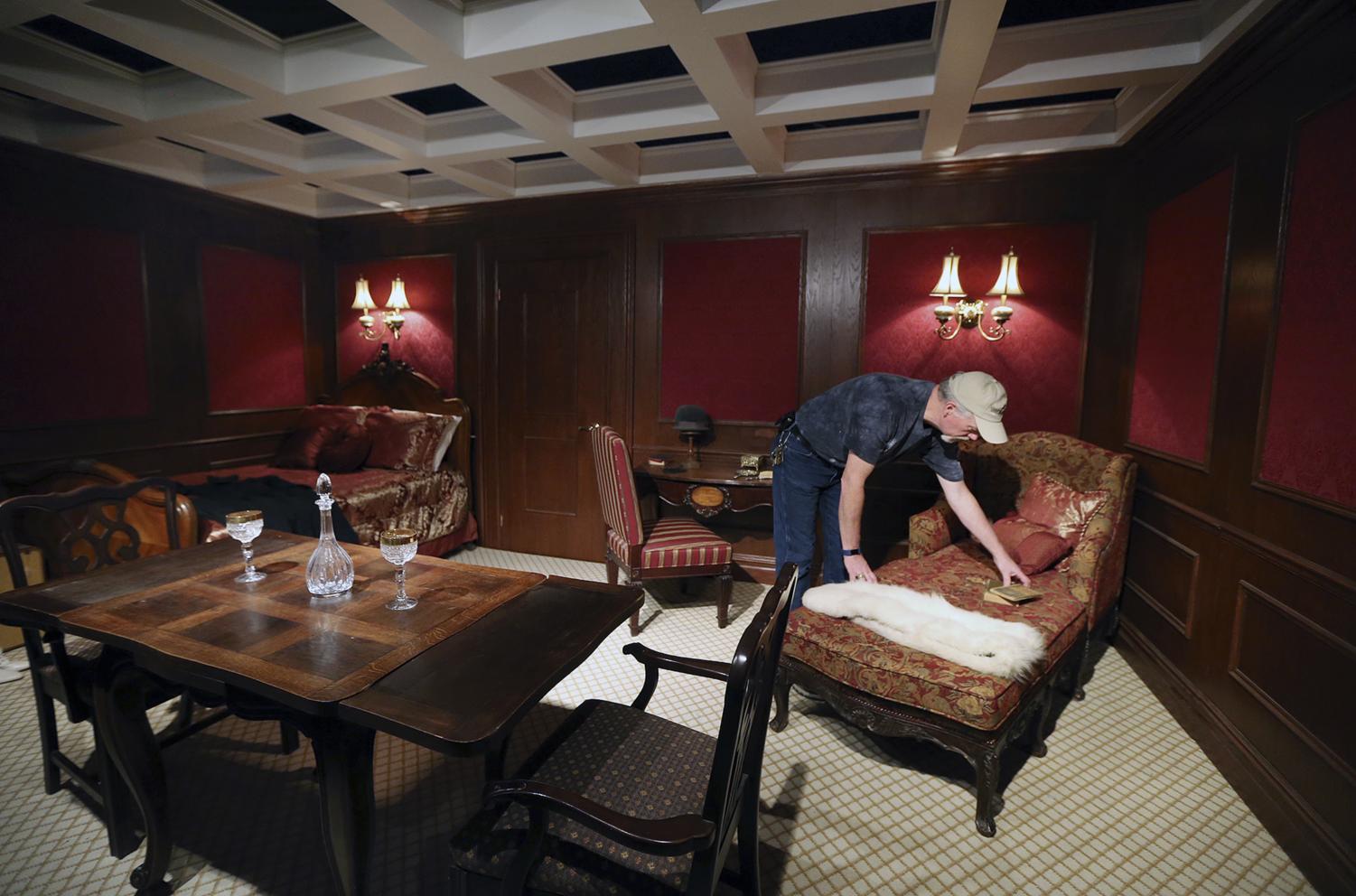 Jeff Huckeby readies a replica of a First-Class state room at the Titanic exhibit May 30 at Baylor University's Mayborn Museum in Waco, Texas. The exhibit features more than 150 objects found during deep-sea expeditions to the wreck site in the north Atlantic Ocean, supplemented by replica items, rooms, a frozen iceberg wall, videos and displays.