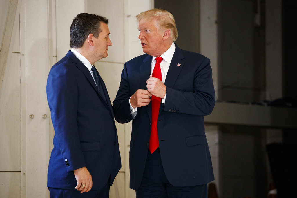 Sen. Ted Cruz talks with President Donald Trump before a meeting with families of the Santa Fe school shooting at Coast Guard Air Station Houston on May 31, 2018.