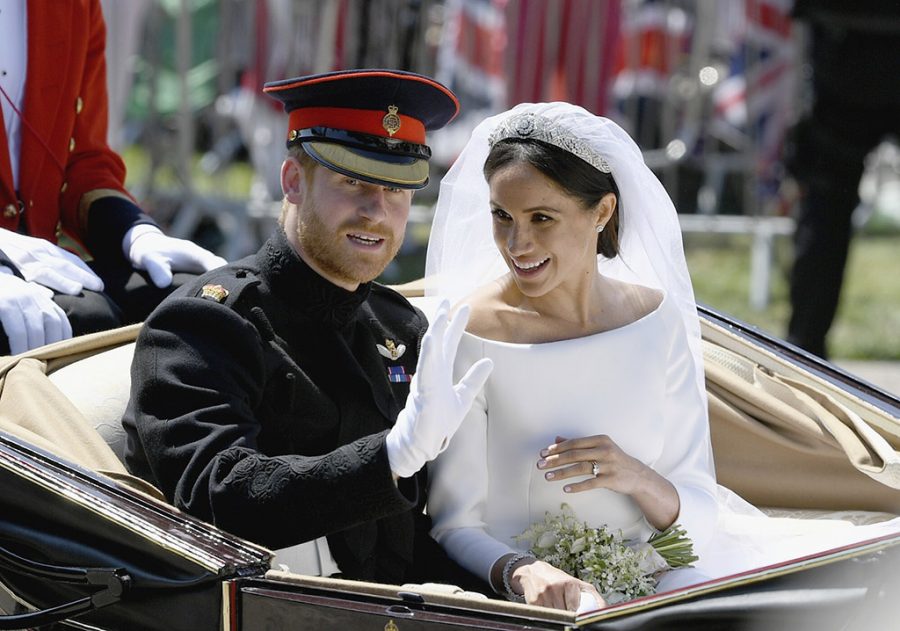 Markle and Prince Harry riding in a carriage after their wedding