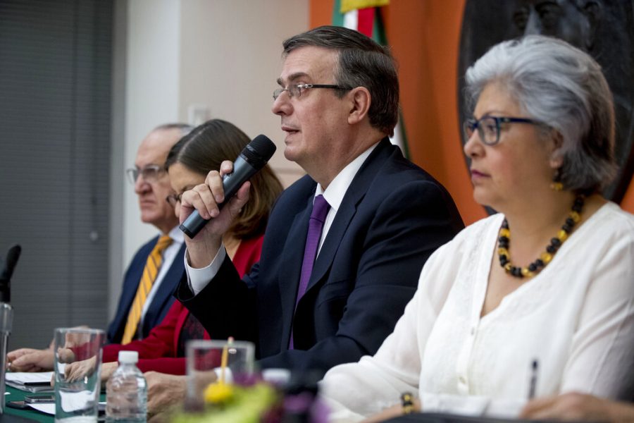 Mexican Foreign Affairs Secretary Marcelo Ebrard, center, speaks at a news conference at the Mexican Embassy in Washington on Monday. A Mexican delegation is also arriving in Washington for talks following trade tariff threats from the Trump Administration. 