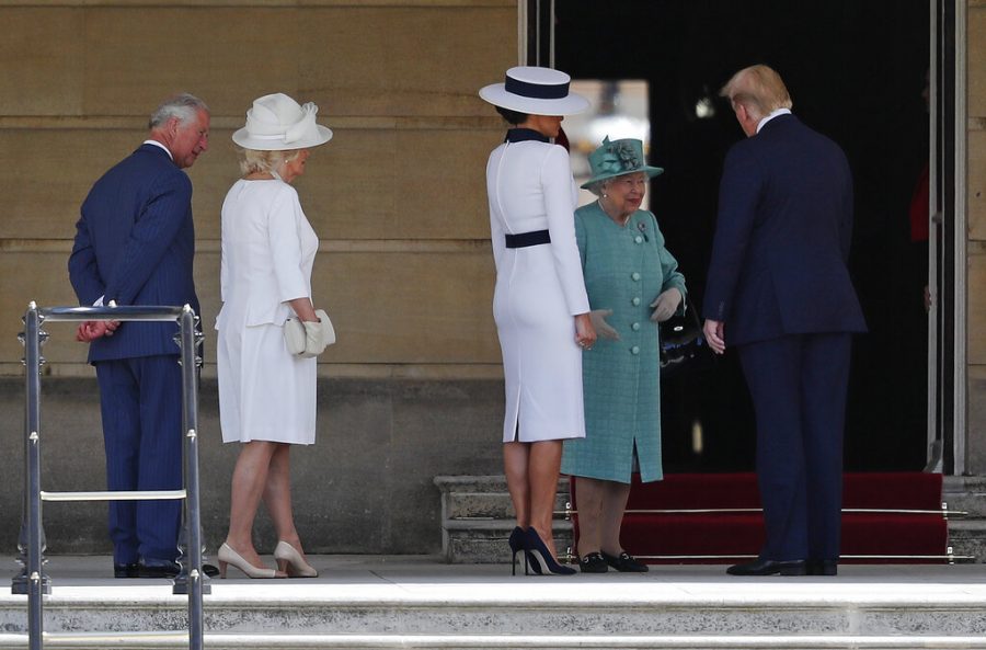 Britains Queen Elizabeth II greets President Donald Trump, right, and first lady Melania Trump with Britains Prince Charles, left, and Camilla, Duchess of Cornwall during a ceremonial welcome in the garden of Buckingham Palace in London, Monday, June 3, 2019 on the opening day of a three day state visit to Britain. (AP Photo/Frank Augstein)