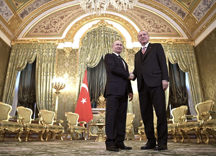 FILE - In this April 8, 2019, file photo, Russian President Vladimir Putin, left, and Turkish President Recep Tayyip Erdogan shake hands during their meeting in the Kremlin in Moscow, Russia. The violence raging once again in the northwestern province of Idlib, Syrias last rebel-held bastion, is putting Turkish-Russian relations to the test. (Alexei Nikolsky, Sputnik, Kremlin Pool Photo via AP, File)