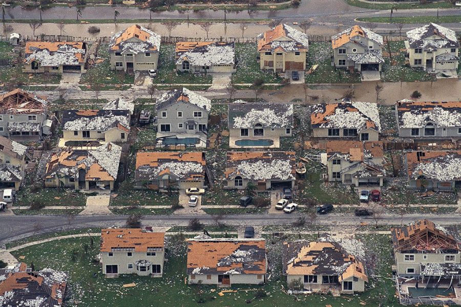 FILE - This Aug. 25, 1992, file photo shows rows of damaged houses between Homestead and Florida City, Fla. In 1992, Homestead was a sleepy agricultural town bordered by the Everglades and large farms planted with winter tomatoes and other crops. Now Homestead is full of sprawling gated developments where many residents commute north to Miami with no memory of the monster storm. (AP Photo/Mark Foley, File)