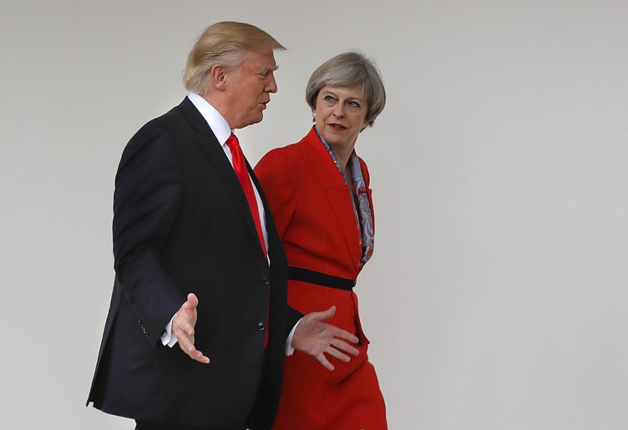 Donald Trump walks with Theresa May