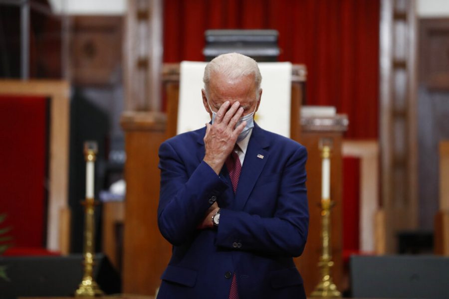 Democratic presidential candidate, former Vice President Joe Biden touches his face as he speaks to members of the clergy and community leaders at Bethel AME Church in Wilmington, Del., June 1. 