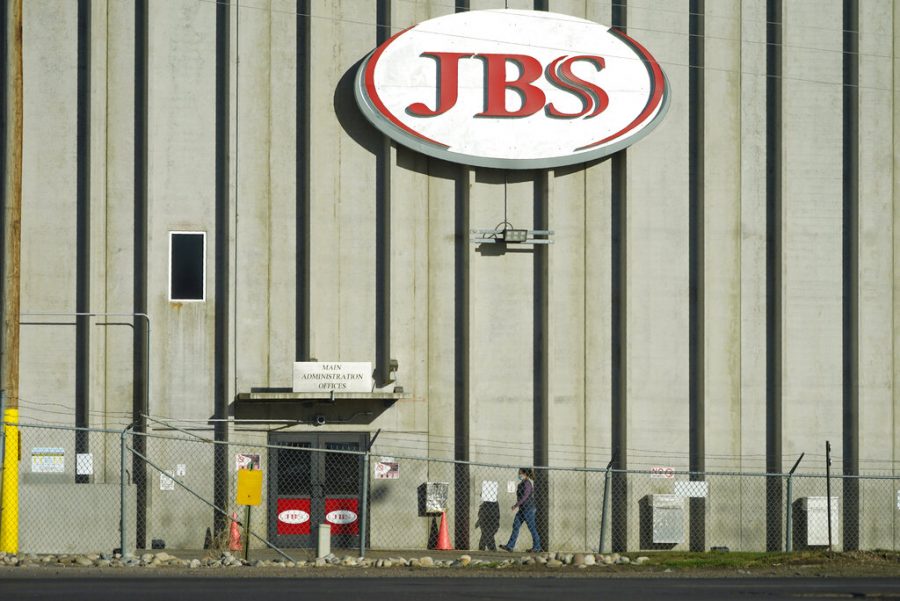 A worker heads into the JBS meatpacking plant in Greeley, CO. The White House confirms that JBS notified the U.S. government May 30, 2021, of a ransom demand from a criminal organization likely based in Russia.