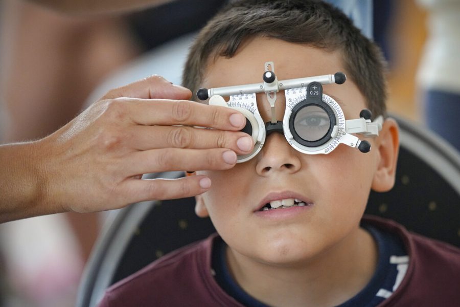 Little boy undergoes an eye exam