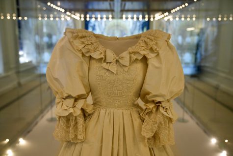 Princess Dianas dress on display in a glass case.