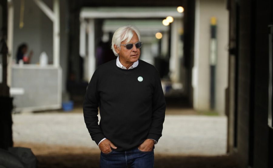FILE - In this May 1, 2019, file photo, trainer Bob Baffert looks out from his barn before a workout at Churchill Downs in Louisville, Ky. Baffert was suspended for two years by Churchill Downs on Wednesday, Mune 2, 2021, after an additional drug test of Medina Spirit confirmed the presence of the steroid betamethasone in the Kentucky Derby winner’s system. (AP Photo/Charlie Riedel, File)