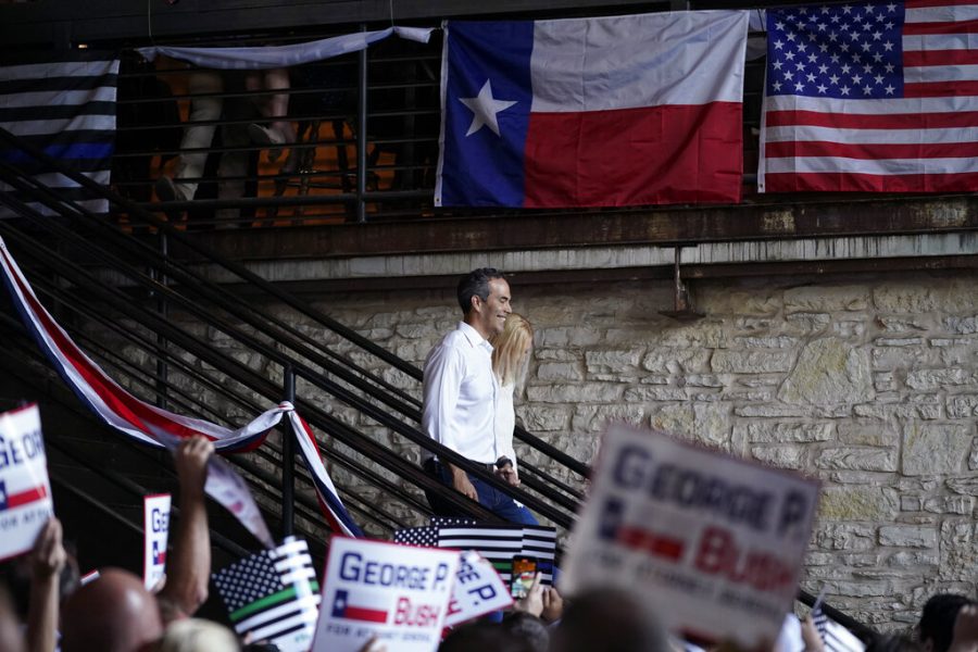 Texas Land Commissioner George P. Bush arrives for a kick-off rally with his wife Amanda to announced he will run for Texas Attorney General, Wednesday, June 2, 2021, in Austin, Texas. (AP Photo/Eric Gay)