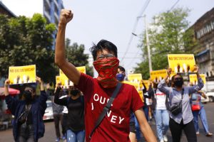 Protester raises his fist in a Myanmar march