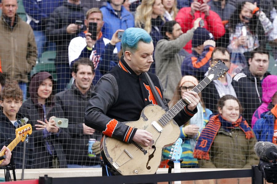 FILE - Musician Jack White performs the national anthem before the first inning of a baseball game between the Detroit Tigers and the Chicago White Sox, Friday, April 8, 2022, in Detroit. Fire destroyed a landmark restaurant and brewpub Friday, May 27, 2022, in Midtown Detroit, but spared the neighboring Third Man Records store owned by musician Jack White as well as Shinolas flagship watch store. (AP Photo/Carlos Osorio, File)