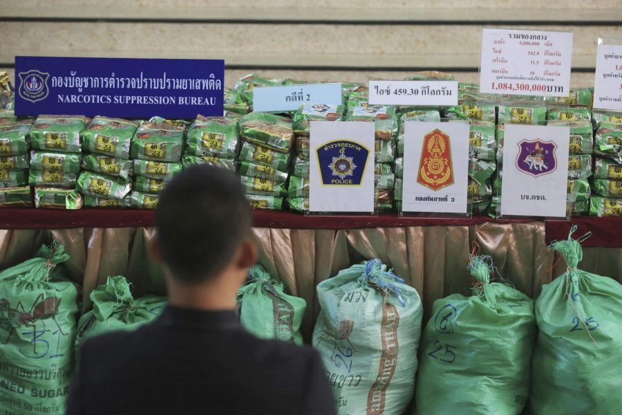 Reporters view packages of methamphetamines on a table during a press conference at Narcotics Suppression Bureau in Bangkok, Thailand on July 15, 2019.
