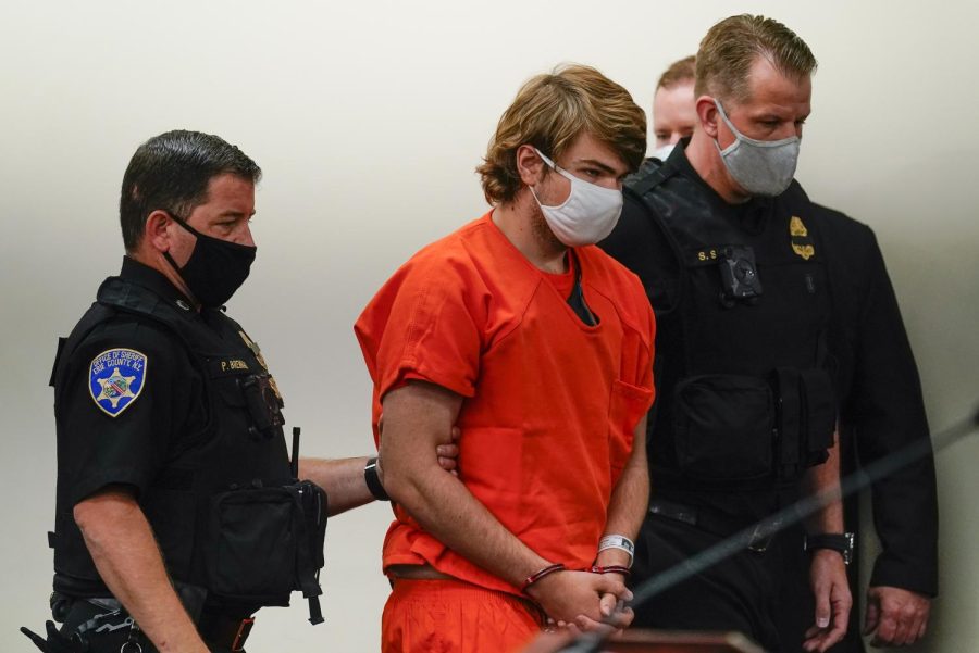 Payton Gendron is led into the courtroom for a hearing at Erie County Court, in Buffalo, N.Y., Thursday, May 19, 2022. Gendron faces charges in the May 14 fatal shooting at a supermarket.