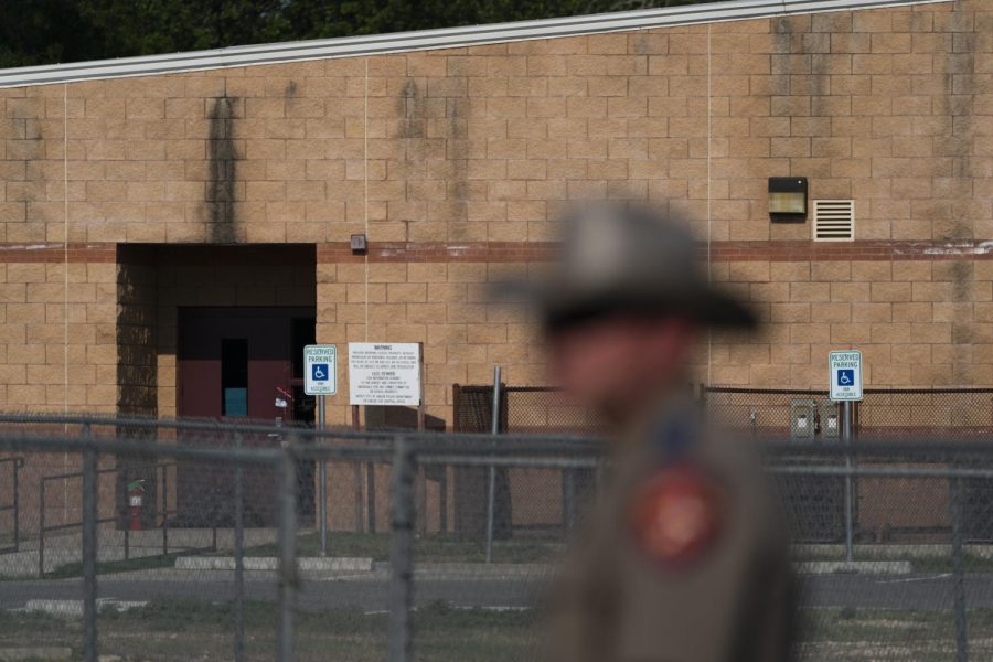 A back door at Robb Elementary School, where a gunman entered through to get into a classroom in last weeks shooting, is seen in the distance in Uvalde, May 30.