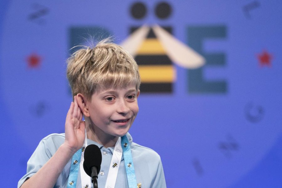 A+10-year-old+boy+listens+at+the+microphone+as+his+word+is+read+during+the+spelling+bee.