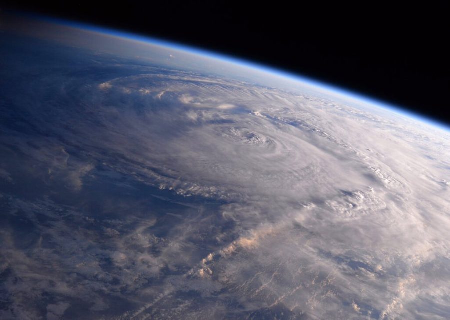 FILE - This photo made available by NASA shows Hurricane Harvey over Texas on Saturday, Aug. 26, 2017, seen from the International Space Station. Studies show that climate change are making hurricanes wetter, because warm air can hold more moisture, and are making the strongest storms a bit stronger. Storms also may be stalling more, allowing them to drop more rain over the same place, like in 2017’s Harvey. They are also rapidly intensifying more often, experts say. (Randy Bresnik/NASA via AP, File)