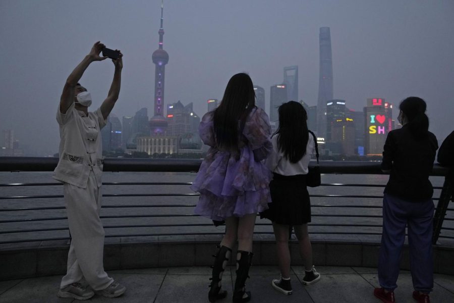 Residents enjoy the view at dusk along the bund after the reopening of Shanghai on June 1.