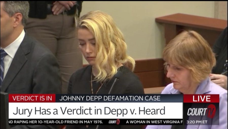 Amber Heard reacts as the jurys verdict is read in the courtroom in the Fairfax County Circuit Courthouse in Fairfax, Va. on June 1, 2022. Depp was not present for the verdict. 