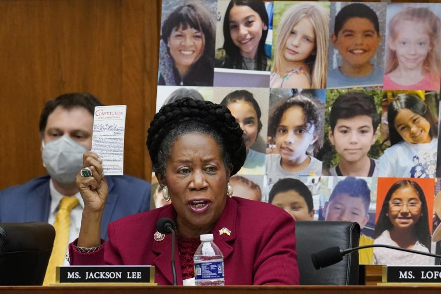 Rep. Sheila Jackson Lee, D-Texas, voices her support of Democratic gun control measures with pictures of victims from the Uvalde mass shooting behind her. The legislation, called the Protecting Our Kids Act, was added to the legislative docket after mass shootings in Texas and New York last week. 