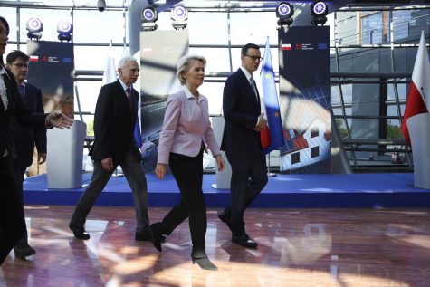 Polands Prime Minister Mateusz Morawiecki and European Commission President Ursula von der Leyen, center, arrive for a news conference at headquarters of Polands Power Grid in Konstancin Jeziorna, Poland, Thursday, June 2, 2022. The independence of Polands courts is at the heart of a dispute with the European Union, which has withheld billions of euros in pandemic recovery funds to Warsaw over the matter. 