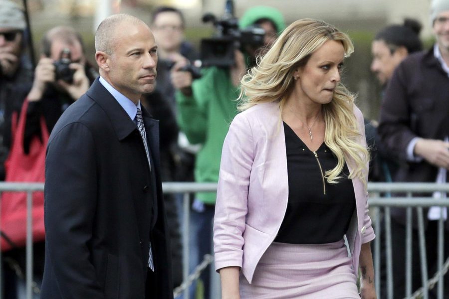 In this 2018 photo, Stormy Daniels and Michael Avenatti turn from microphones as they leave federal court in New York. Avenatti was recently sentenced to 2 1/2 years in prison for stealing book proceeds from her memoir which includes graphic accounts of her relationship with former President Donald Trump. 