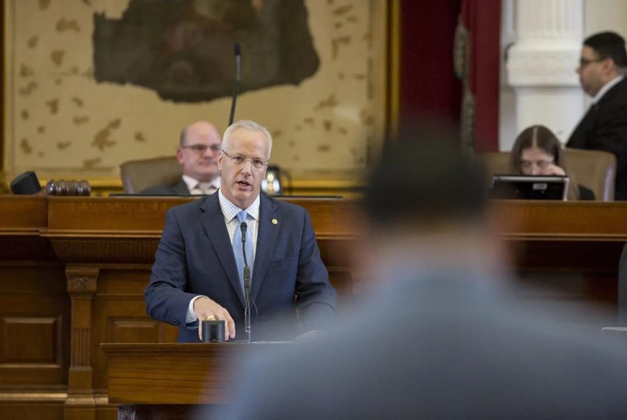 A person stands in a courtroom.