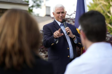 Former Vice President Mike Pence talks with local residents during a meet and greet on May 23, 2023, in Des Moines, Iowa.