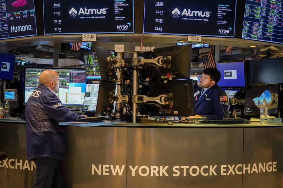 Traders work at their stations at the New York Stock Exchange May 26, 2023.
