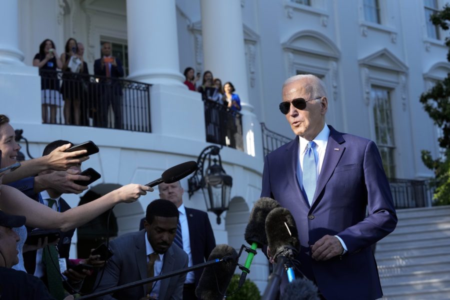 President Joe Biden speaking with reporters in front of the White House.