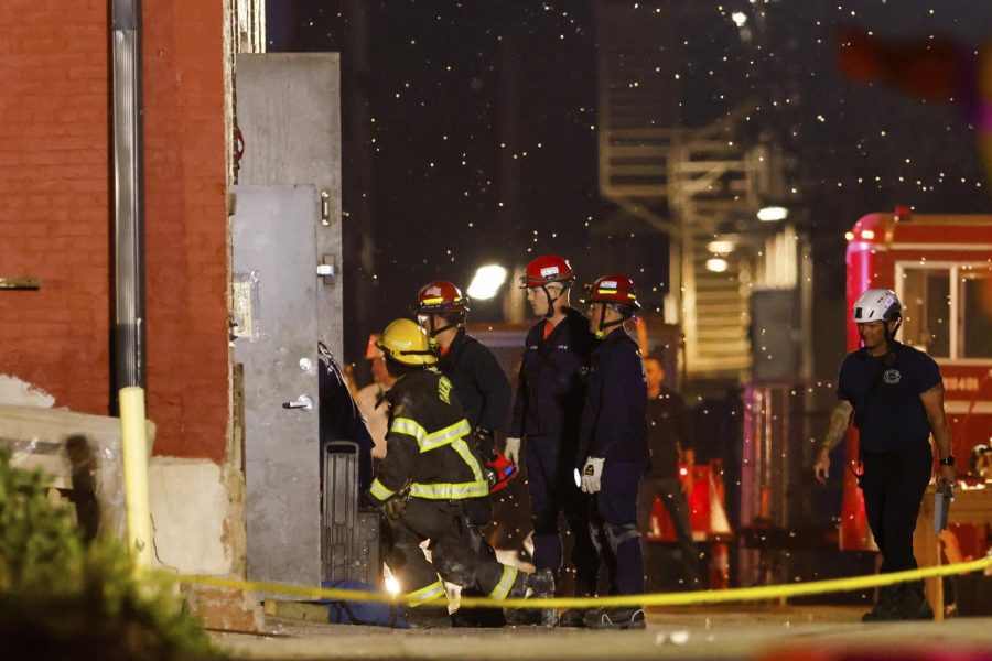 Emergency crews work the scene of a partial building collapse on the 300 block of Main Street.