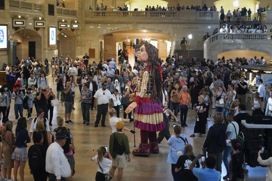 A 12-foot puppet of a 10-year-old Syrian refuge named Little Amal walks around Grand Central Station in New York, on Sept. 15, 2022.