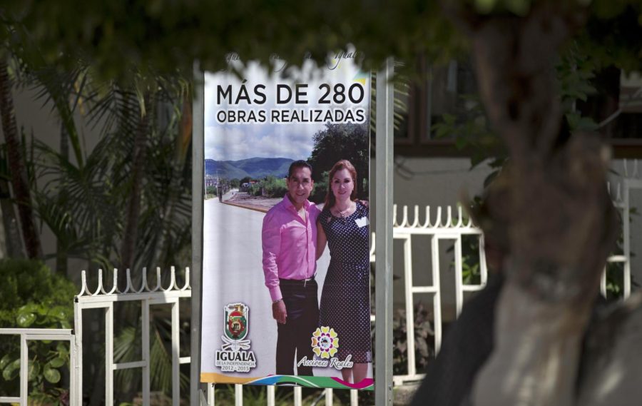 A sign shows then-political candidate Jose Luis Abarca and his wife.