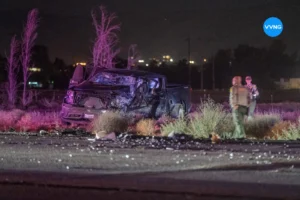 Police investigate a head-on crash scene with damaged vehicles on Bear Valley Road in Apple Valley