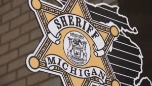 Sheriff's deputies investigate a three-vehicle crash on a rural road in Raisinville Township