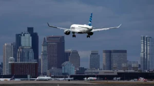 An air ambulance in flight, with investigators examining GPS interference risks after a New Mexico crash